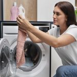 woman-taking-clothes-from-the-washing-machine